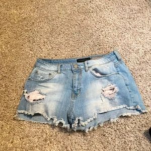 These jeans shorts are blue and size 8